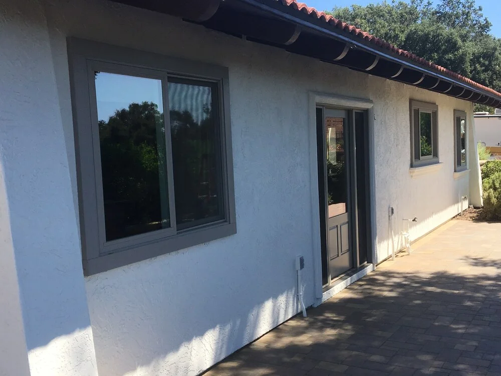 White stucco home with terracotta roof painted by Franklin Custom Finish
